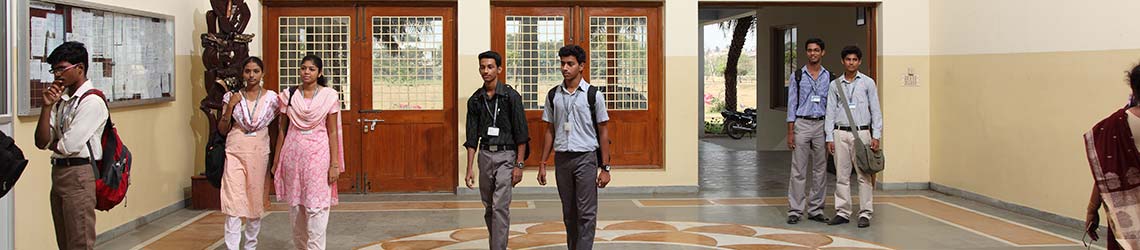 Alpha College of Engineering students walking in the corridor